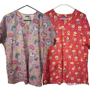 Two pediatric short sleeve scrub tops